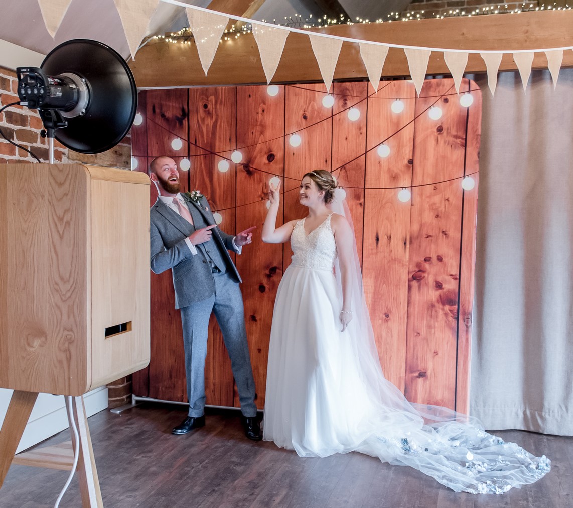 Bride and Groom having fun with a photo booth